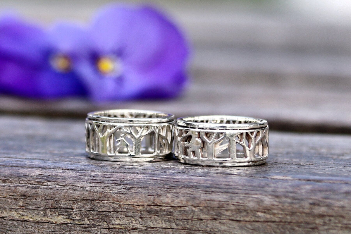 Lady in Nature and Man in Nature sterling silver spinner rings side by side
