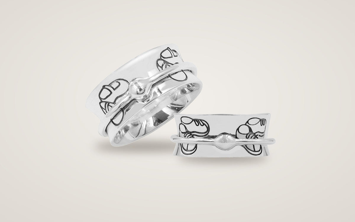 Son and Daughter sterling silver spinner rings, each engraved with baby shoes