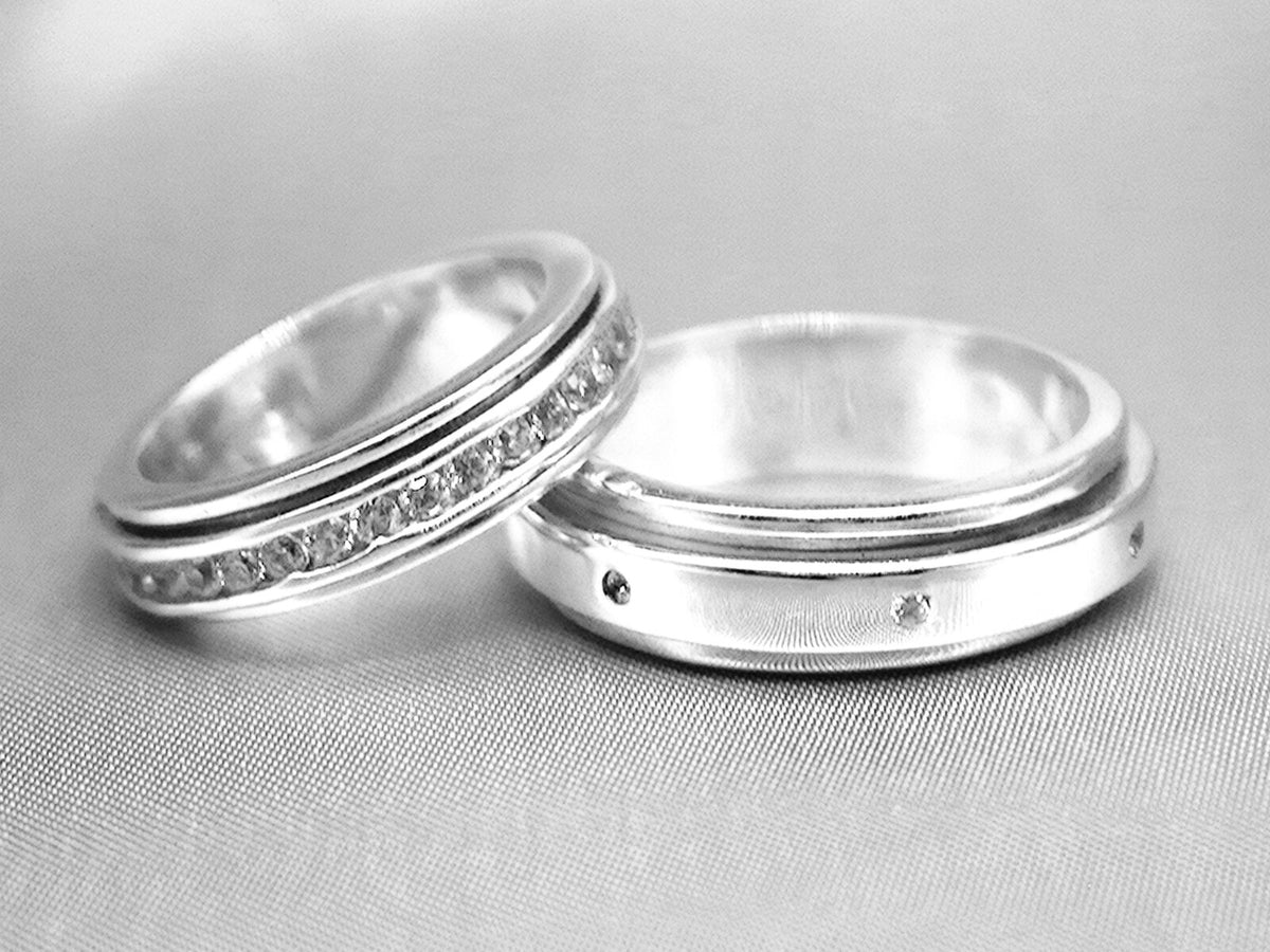 A pair of silver spinner rings