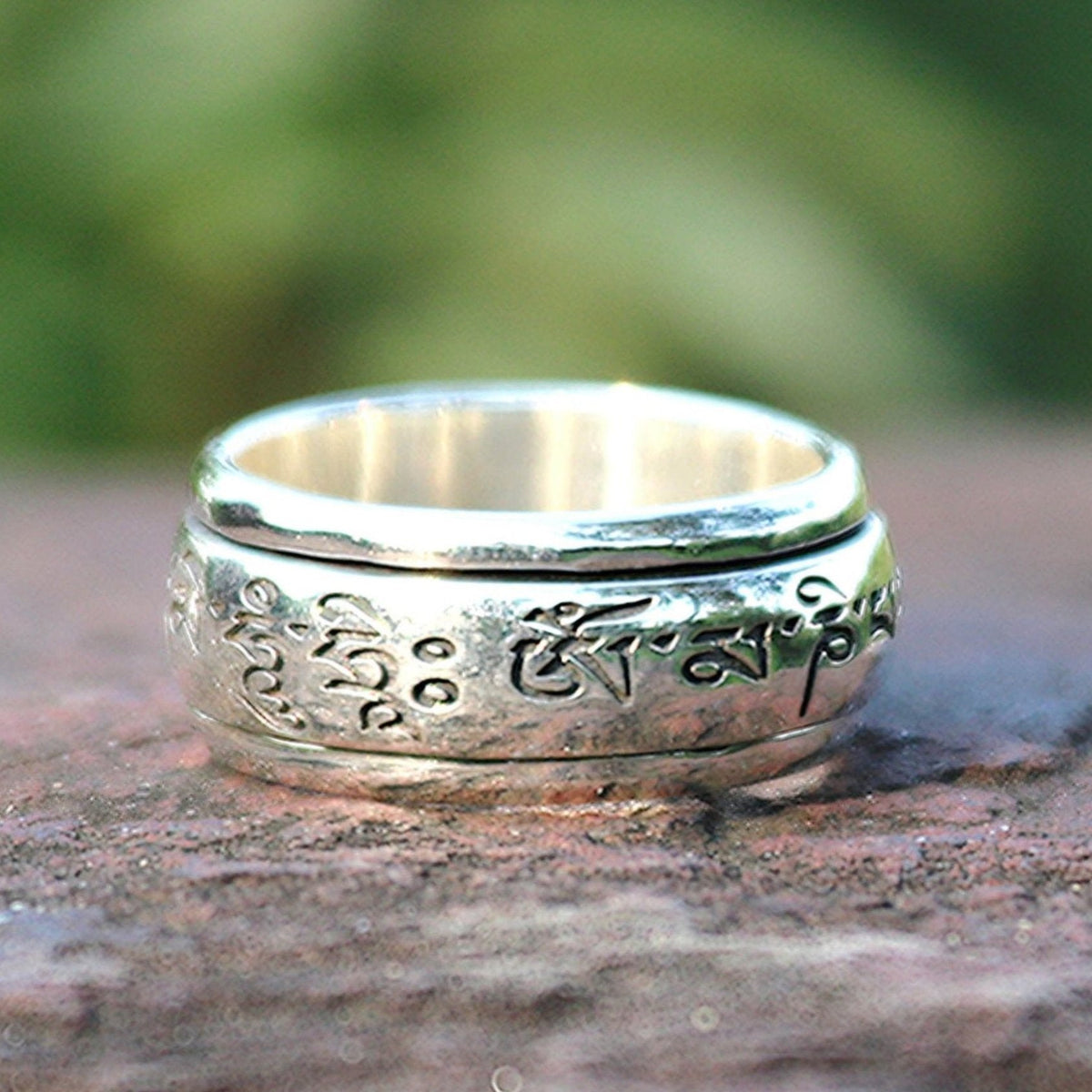 Mantra sterling silver spinner ring by Energy Stone
